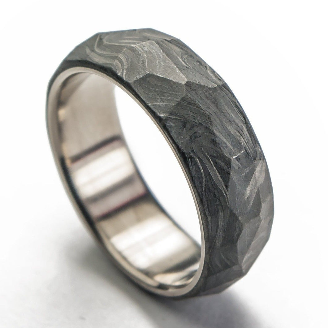 Forged carbon fiber ring with titanium